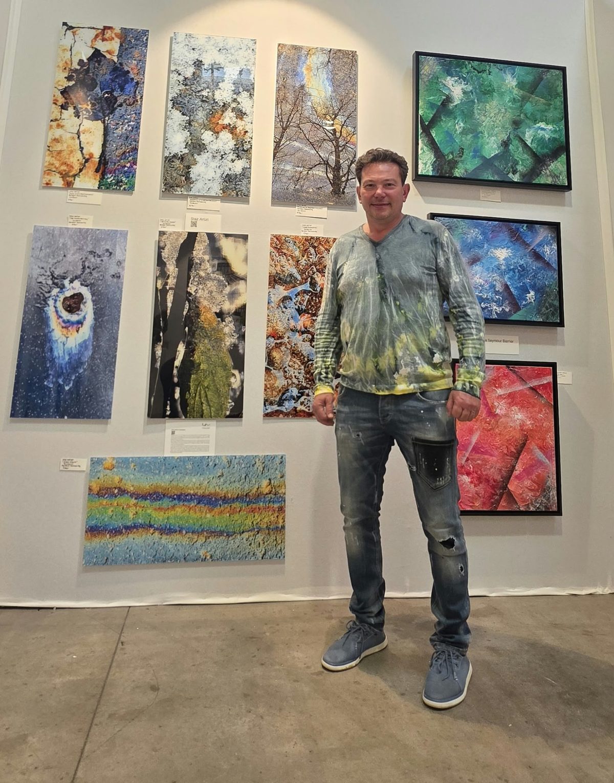 STAZ ARTIZT (Stanislav Patiouk) in front of his series Transcendental Illusions at art3f Luxembourg, October 2026